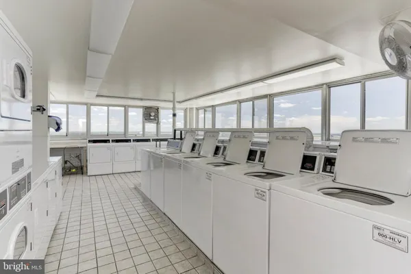 a kitchen with counter top space cabinets and appliances