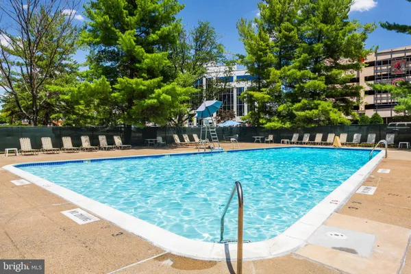 a view of a swimming pool with a patio