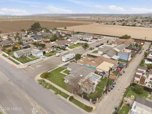 an aerial view of residential houses with outdoor space