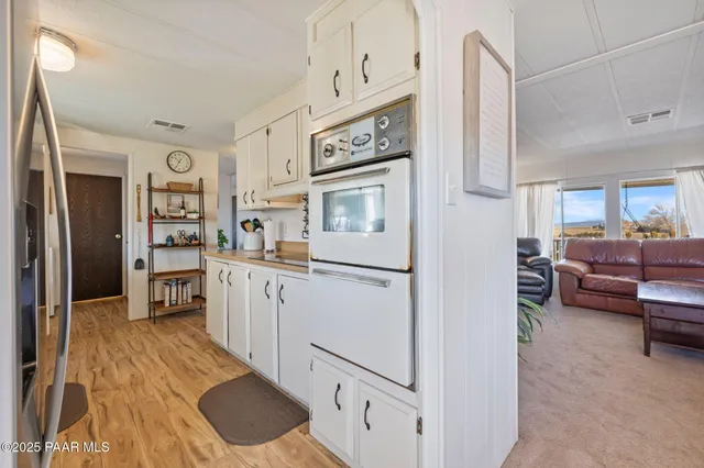 a kitchen with stainless steel appliances a refrigerator sink and cabinets