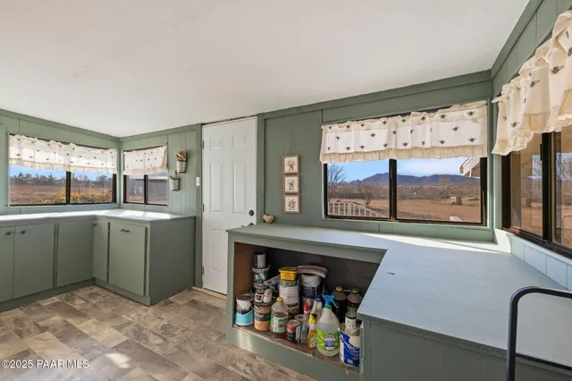 a room with window and mirror