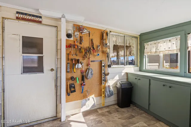 a bathroom with a granite countertop sink a mirror and a shower