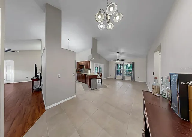 a view of a livingroom with furniture and a flat screen tv