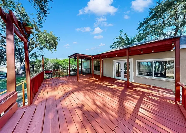 a view of a patio with wooden floor