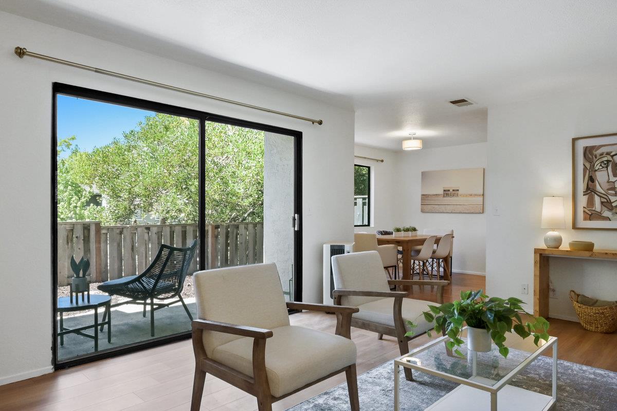 a view of a dining room with furniture window and outside view
