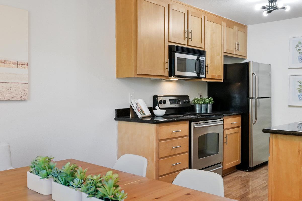 900 Cambridge Drive, Unit 181 Benicia, CA 94510 - Photo 12 of 38 a kitchen with stainless steel appliances granite countertop a refrigerator stove top oven and sink