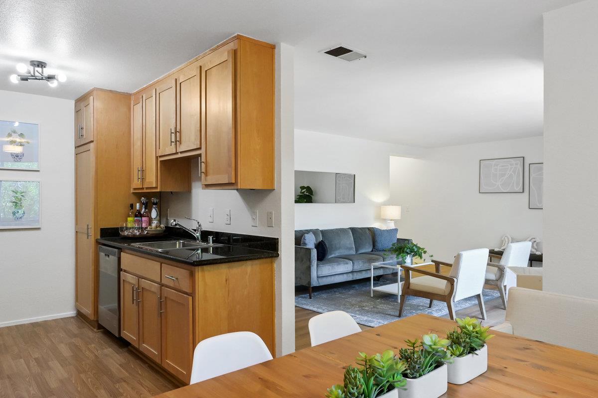 900 Cambridge Drive, Unit 181 Benicia, CA 94510 - Photo 13 of 38 a kitchen with stainless steel appliances granite countertop a stove a sink dishwasher and cabinets with wooden floor