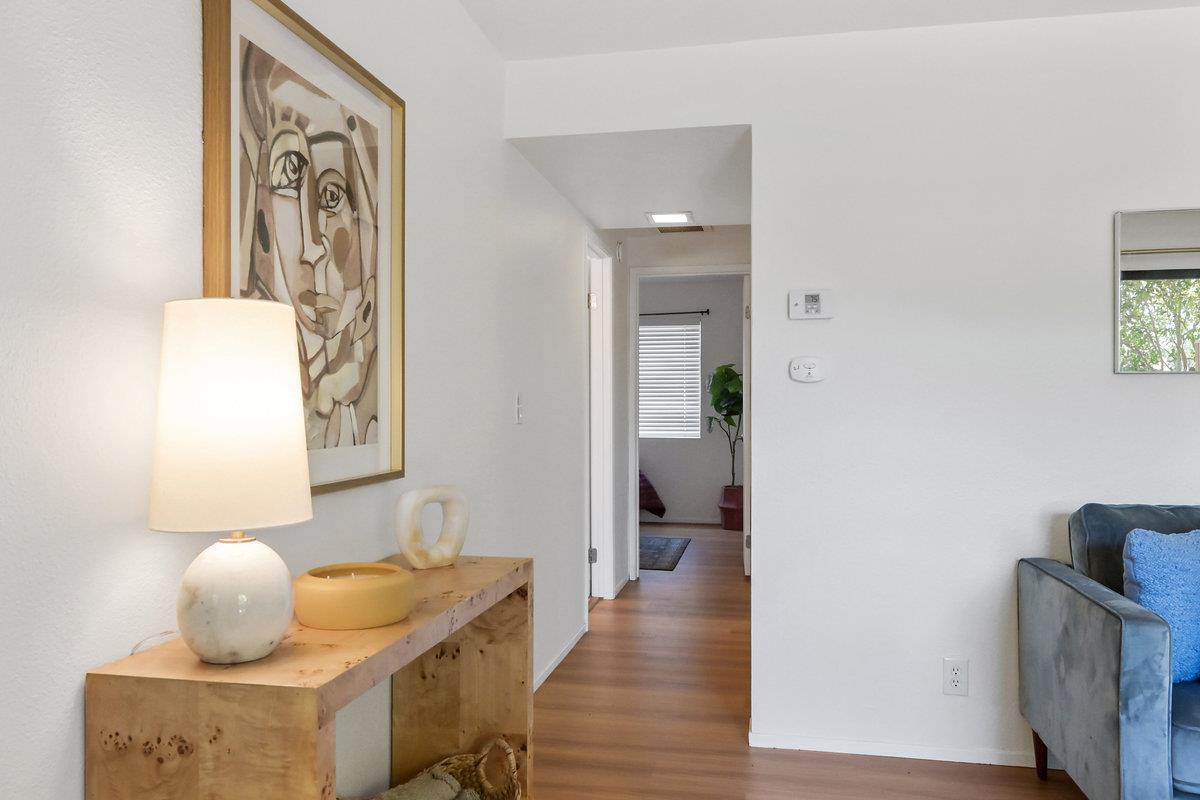 900 Cambridge Drive, Unit 181 Benicia, CA 94510 - Photo 14 of 38 a hallway with furniture and wooden floor