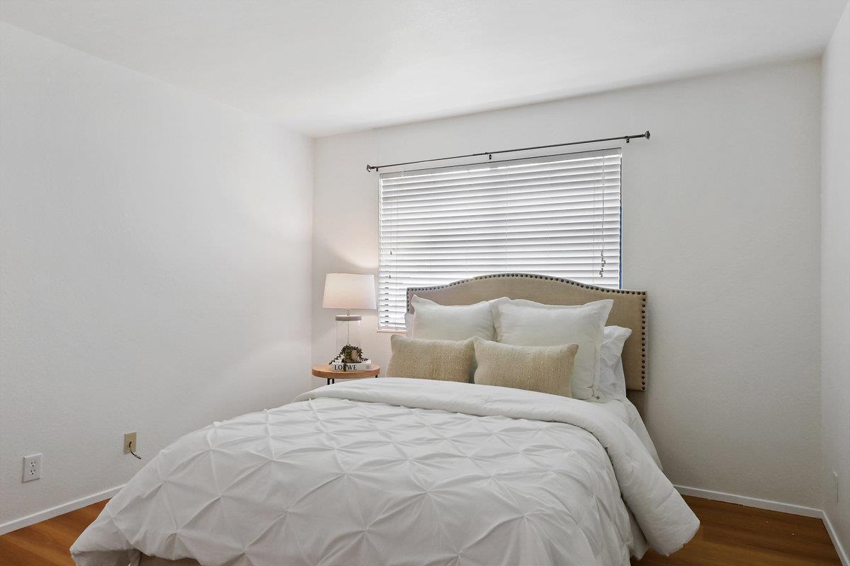 900 Cambridge Drive, Unit 181 Benicia, CA 94510 - Photo 27 of 38 a bedroom with a bed and a night stand