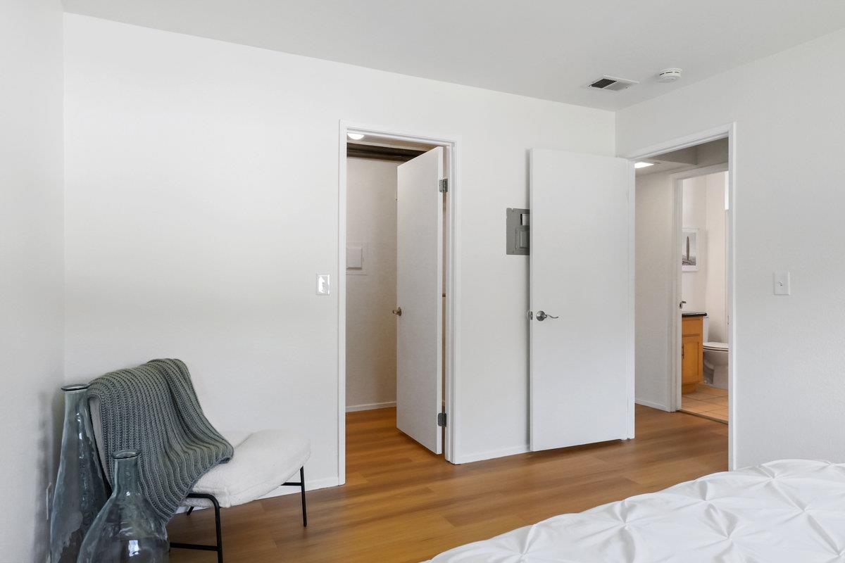 900 Cambridge Drive, Unit 181 Benicia, CA 94510 - Photo 30 of 38 a view of a hallway with wooden floor and glass door