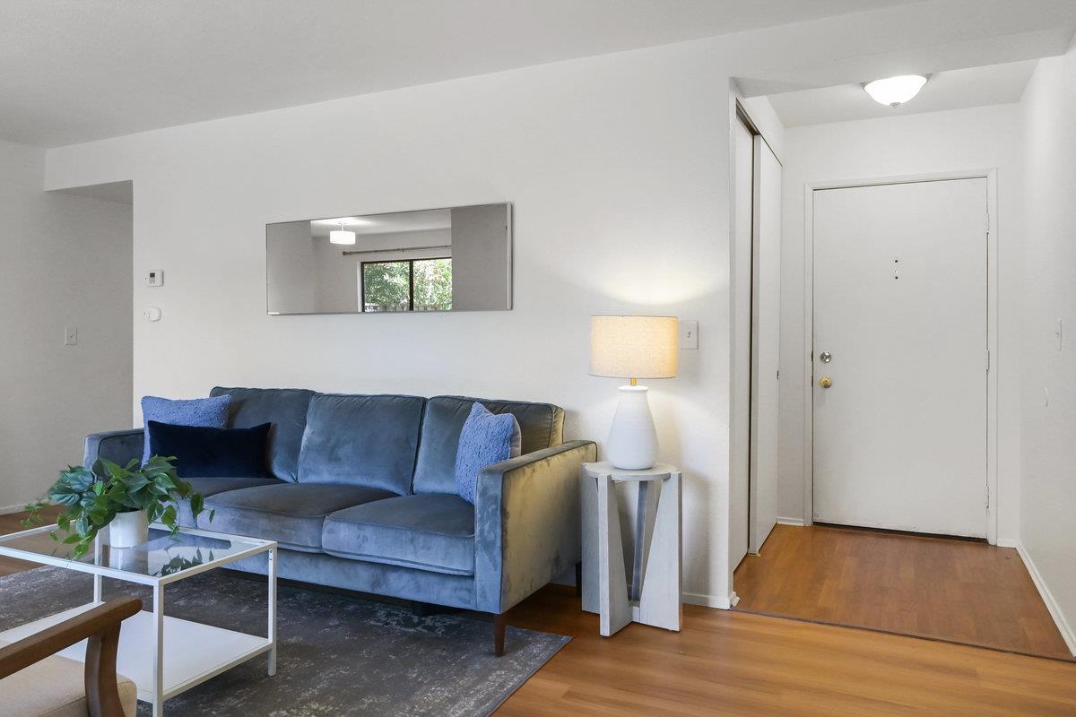 900 Cambridge Drive, Unit 181 Benicia, CA 94510 - Photo 4 of 38 a living room with furniture and a wooden floor