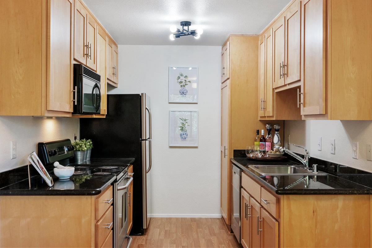 900 Cambridge Drive, Unit 181 Benicia, CA 94510 - Photo 8 of 38 a kitchen with stainless steel appliances granite countertop a sink stove and refrigerator