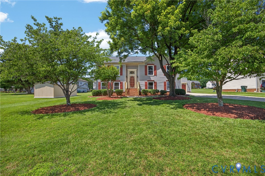 1559 Tree Ridge Road Henrico, VA 23231 - Photo 2 of 40 Traditional-style home with gray siding and red sh