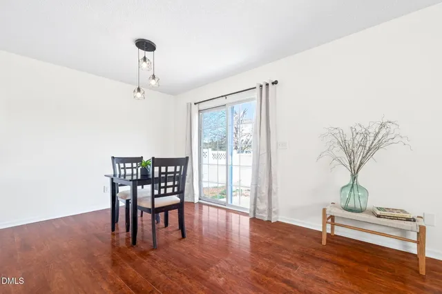 a view of a livingroom with furniture and wooden floor