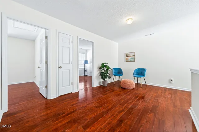 a view of an entryway with wooden floor