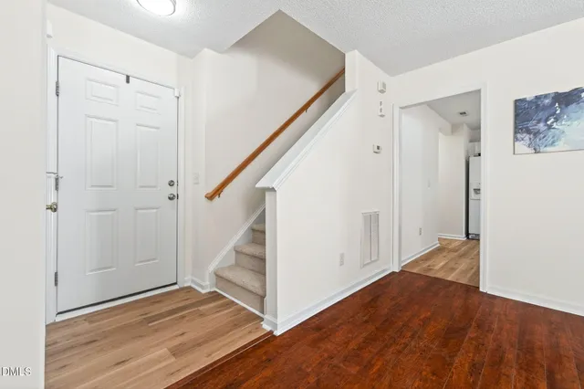 a view of entryway with wooden floor