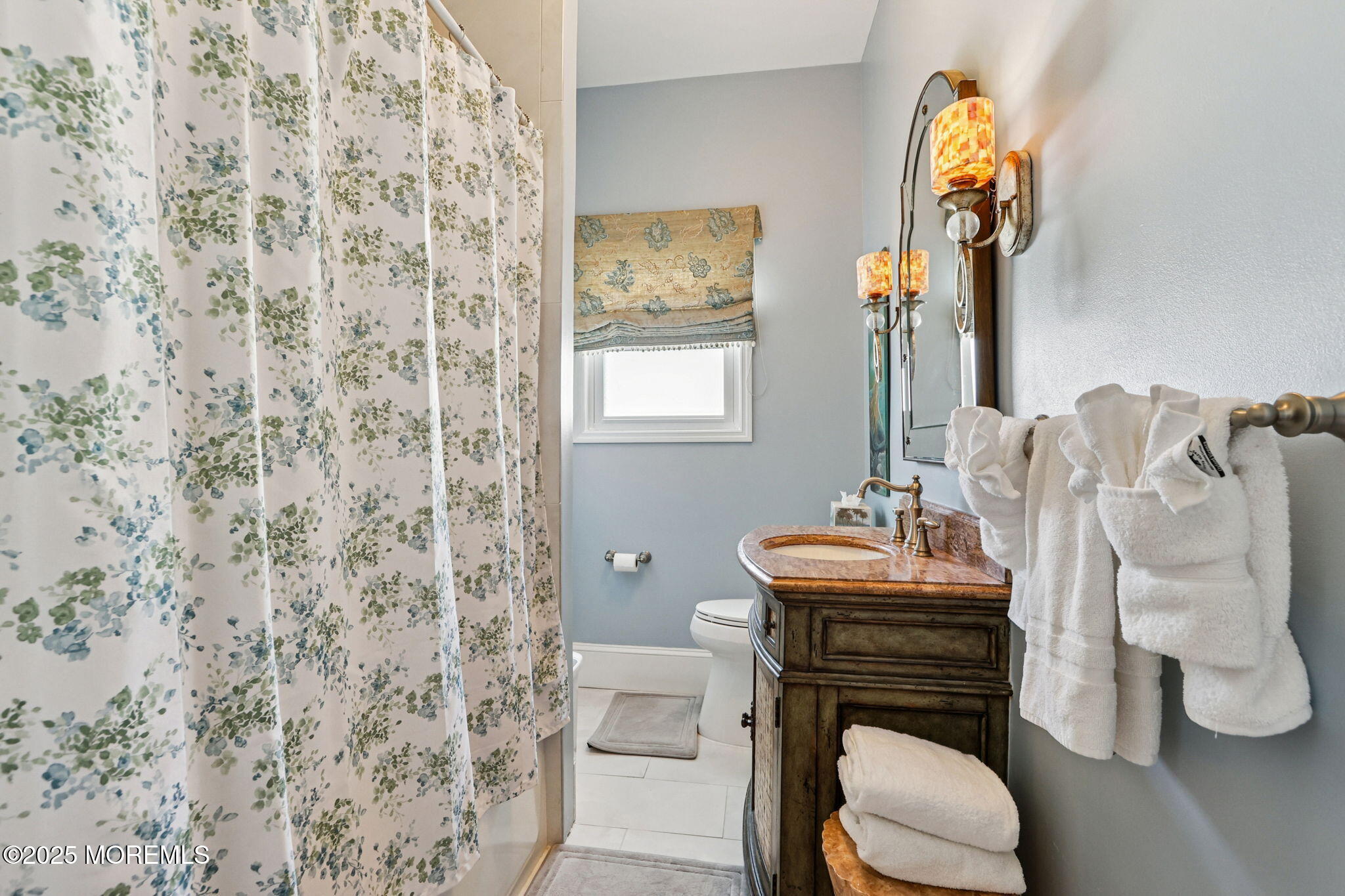 200 Monmouth Avenue, Unit 19 Spring Lake, NJ 07762 - Photo 13 of 28 a bathroom with a granite countertop toilet sink and mirror