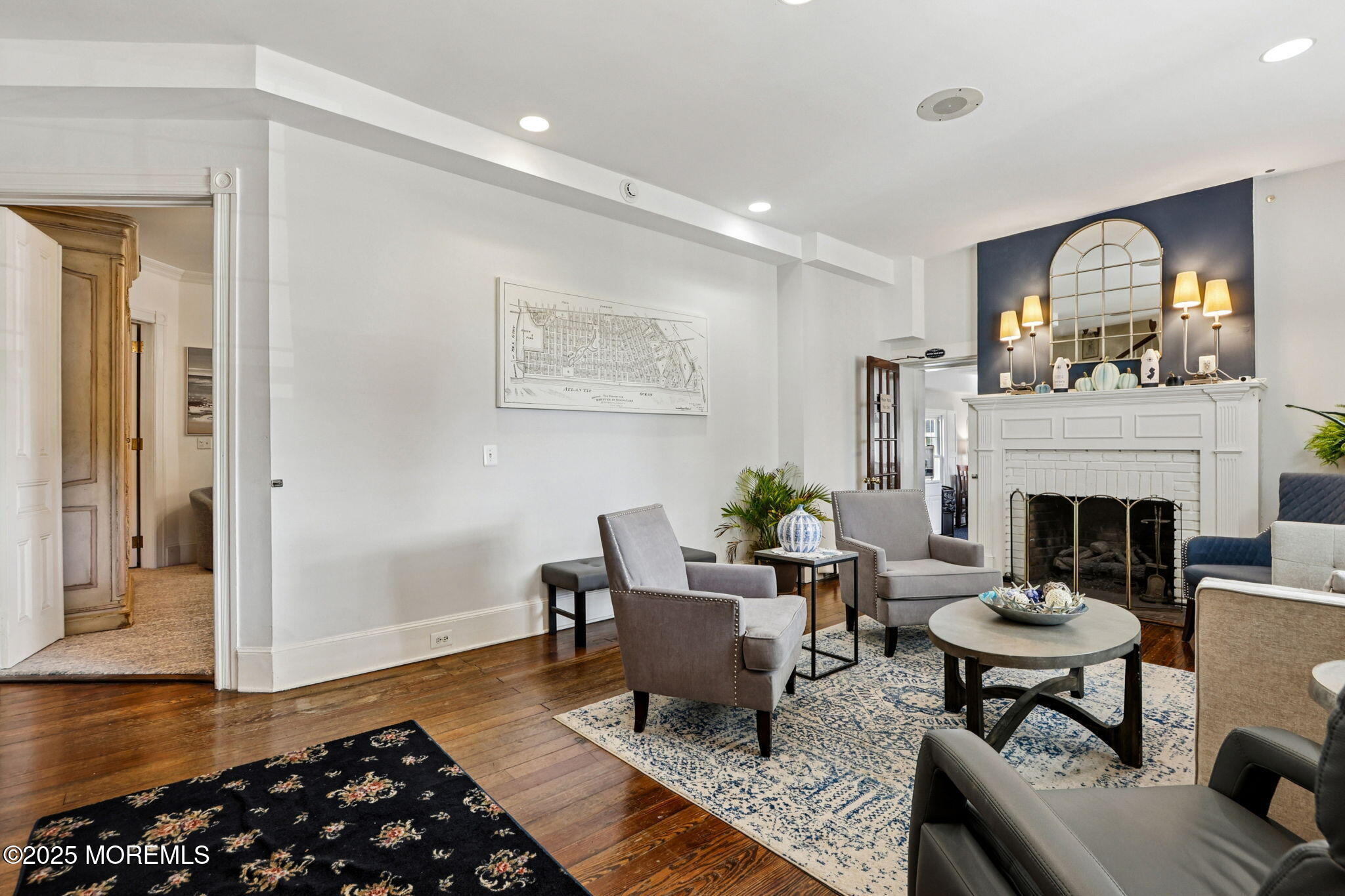 200 Monmouth Avenue, Unit 19 Spring Lake, NJ 07762 - Photo 16 of 28 a living room with furniture and a fireplace