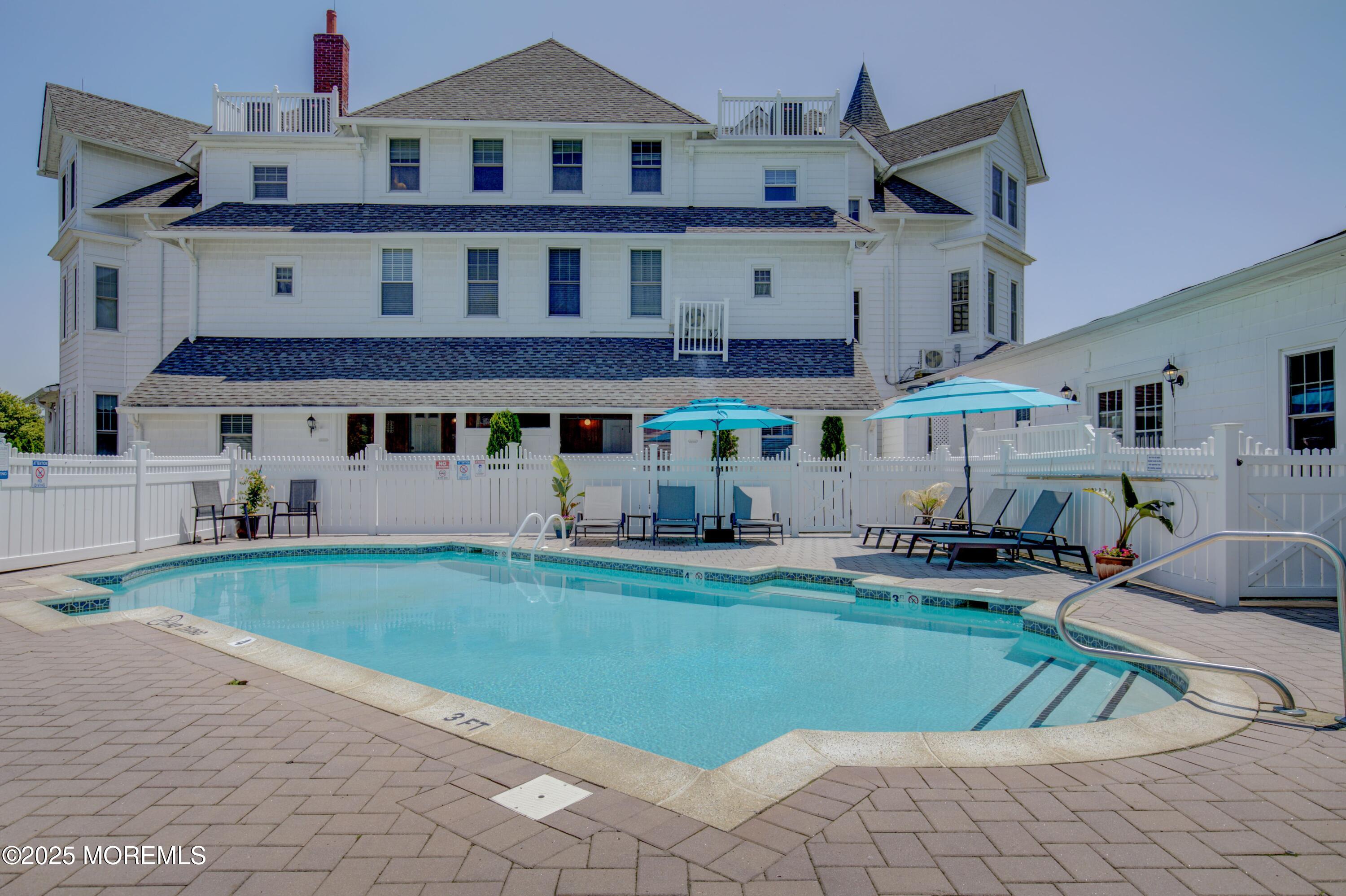 200 Monmouth Avenue, Unit 19 Spring Lake, NJ 07762 - Photo 26 of 28 a view of house with outdoor space and sitting area