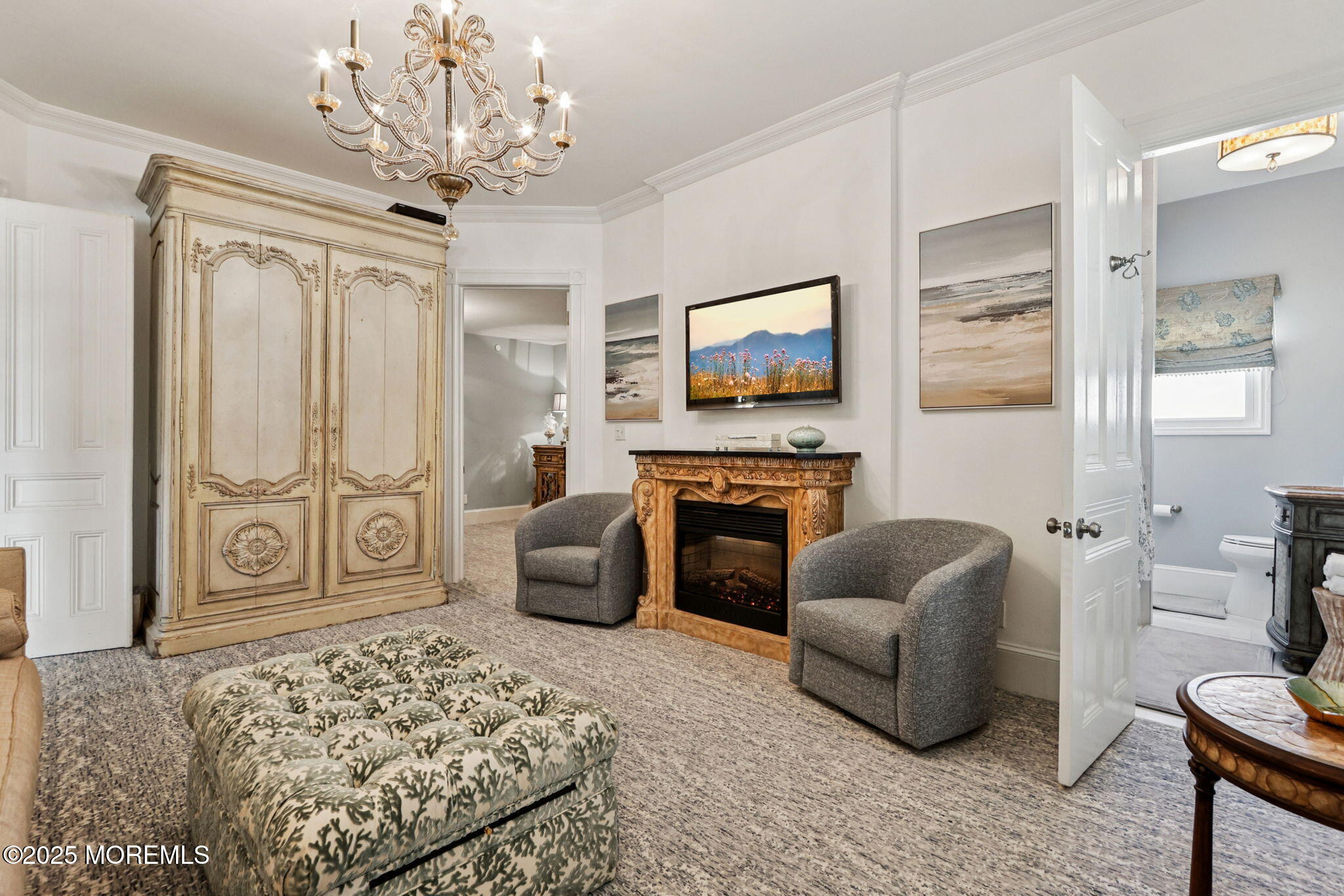 200 Monmouth Avenue, Unit 19 Spring Lake, NJ 07762 - Photo 6 of 28 a living room with furniture a fireplace and a flat screen tv