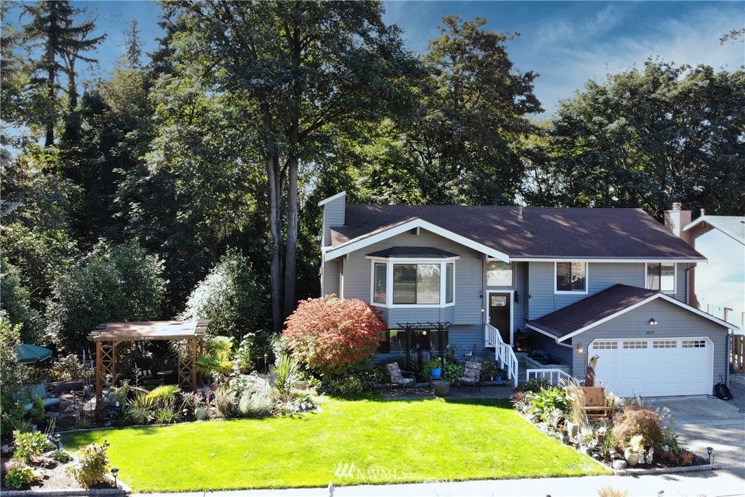 2831 Whitworth Avenue South Renton, WA 98055 - Photo 1 of 40 a front view of a house with a garden and yard