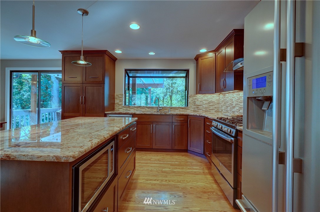 2831 Whitworth Avenue South Renton, WA 98055 - Photo 12 of 40 a kitchen with stainless steel appliances granite countertop a sink and stove