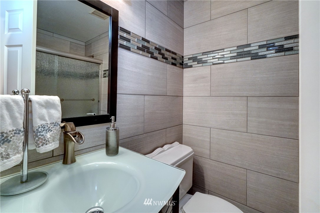 2831 Whitworth Avenue South Renton, WA 98055 - Photo 17 of 40 a bathroom with a sink toilet and shower