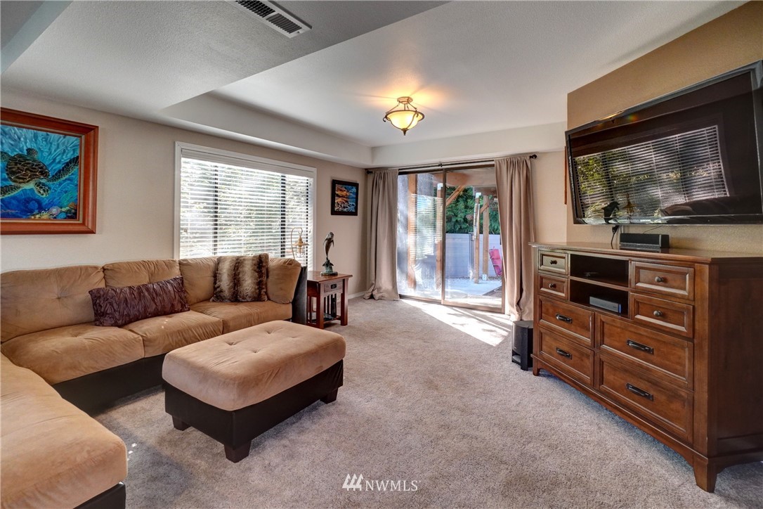 2831 Whitworth Avenue South Renton, WA 98055 - Photo 26 of 40 a living room with furniture and a flat screen tv