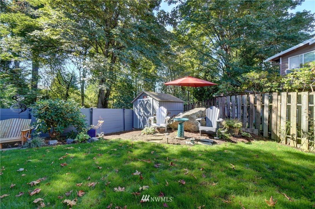 2831 Whitworth Avenue South Renton, WA 98055 - Photo 34 of 40 a view of a chair and table under an umbrella