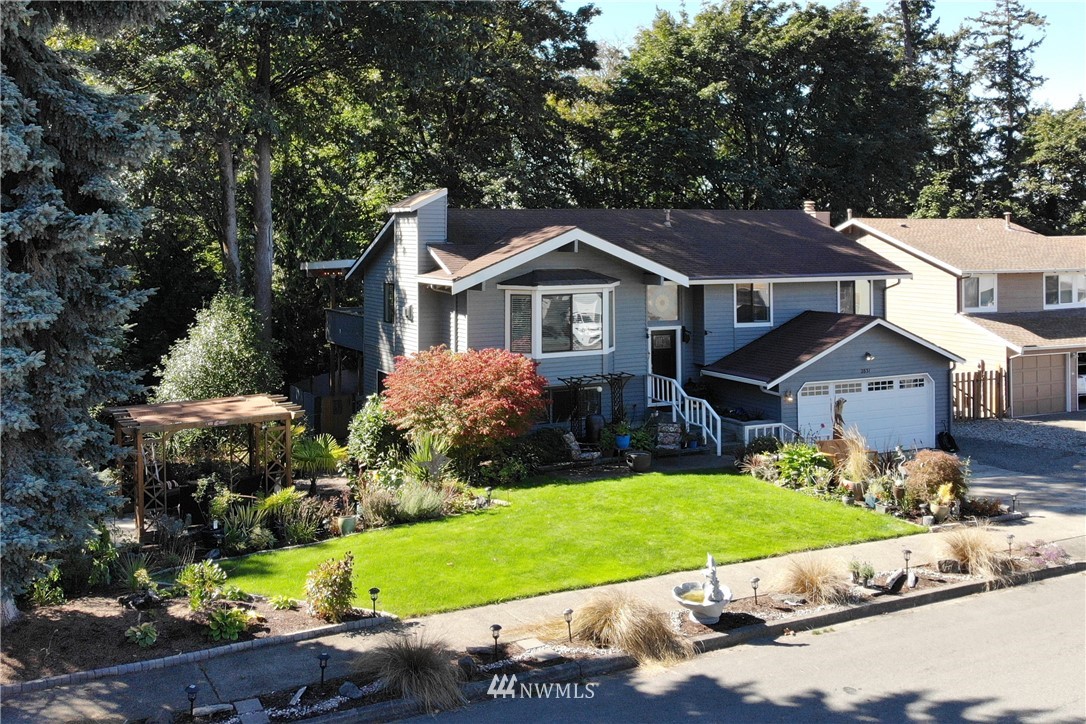 2831 Whitworth Avenue South Renton, WA 98055 - Photo 38 of 40 a front view of a house with a yard and a garage