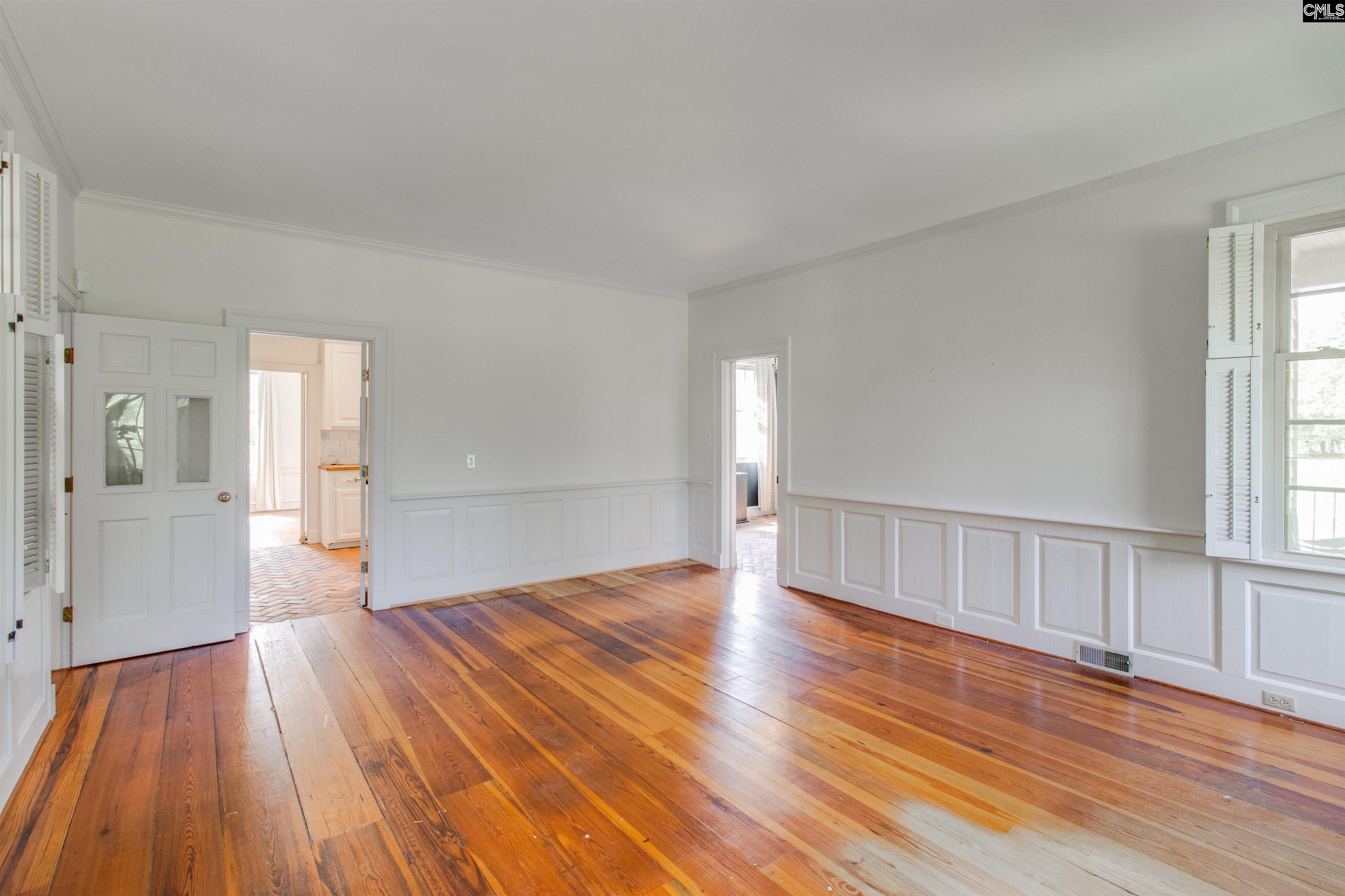 701 Longtown Road Columbia, SC 29229 - Photo 15 of 26 a view of empty room with wooden floor and fan
