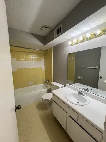 a bathroom with a sink double vanity and a mirror
