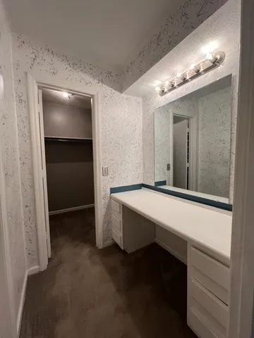 a room with pool table and chandelier