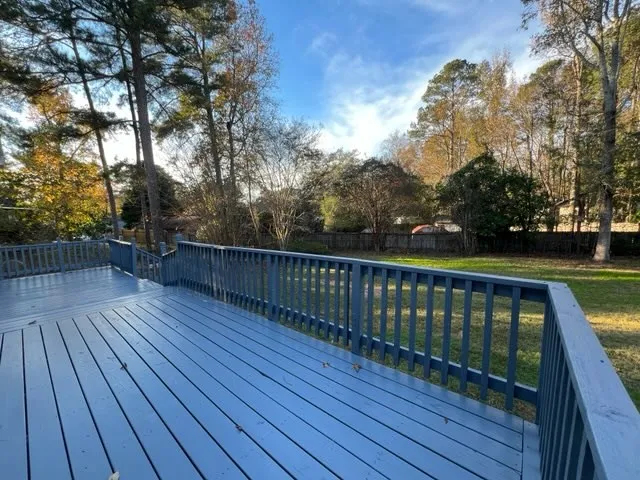 a view of deck with wooden floor and fence with wooden floor