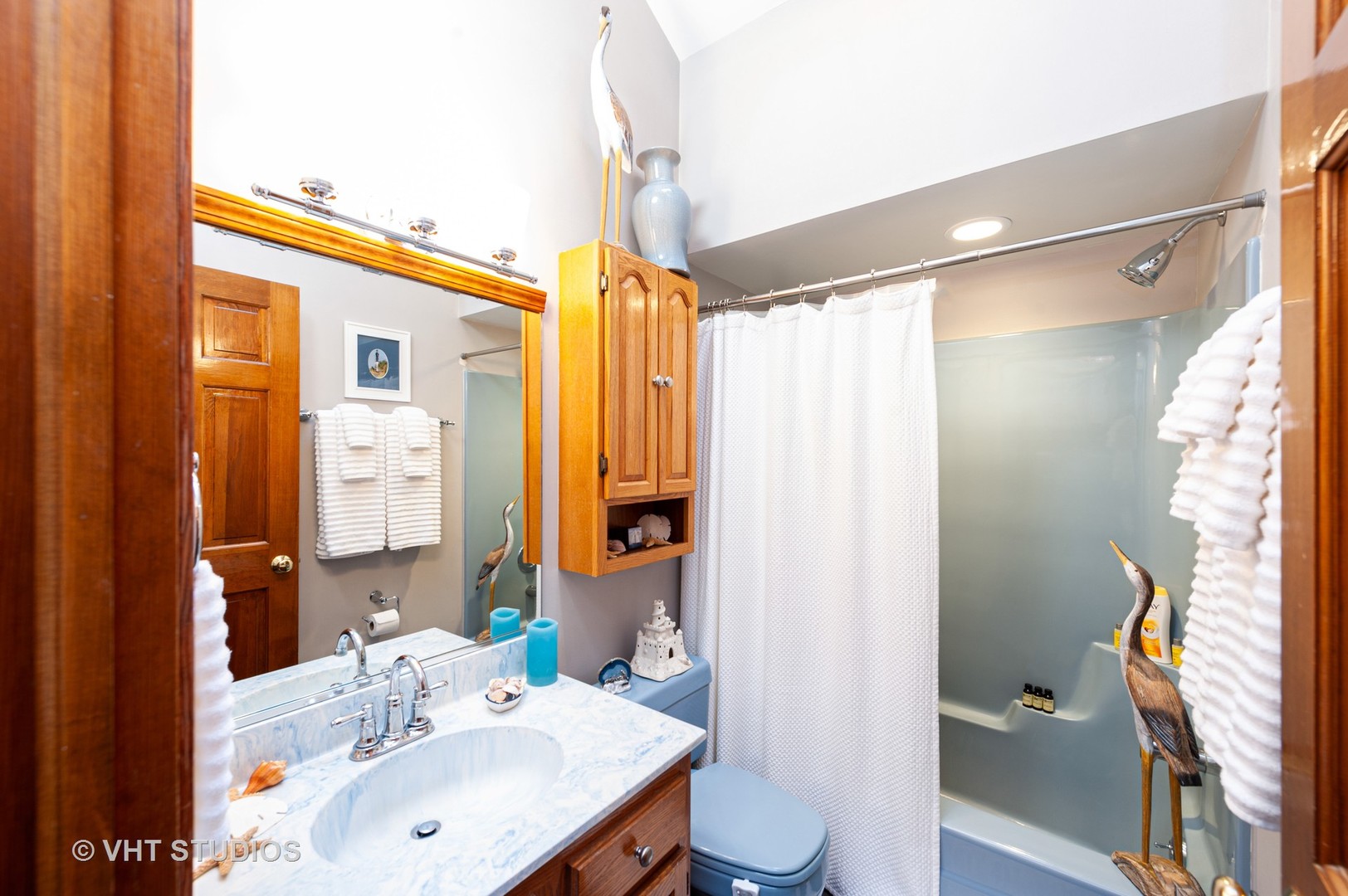 227 Perth Road Cary, IL 60013 - Photo 17 of 19 a bathroom with a sink and a mirror