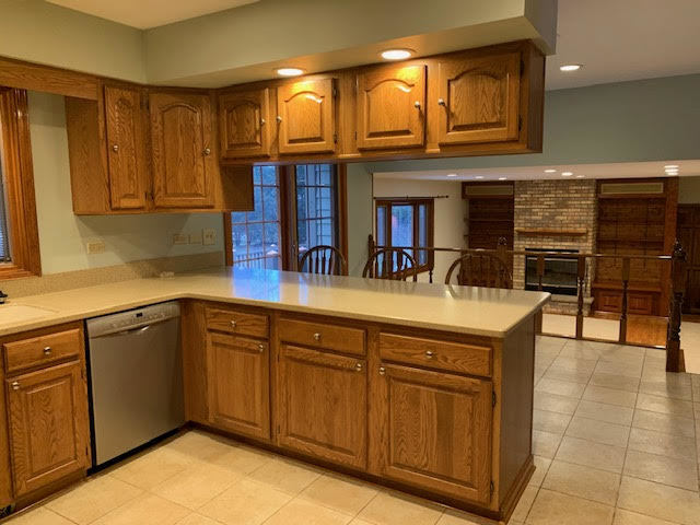227 Perth Road Cary, IL 60013 - Photo 6 of 19 a kitchen with stainless steel appliances granite countertop a sink and cabinets