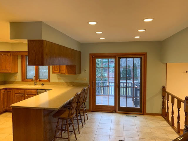 227 Perth Road Cary, IL 60013 - Photo 7 of 19 a kitchen with a sink a counter top space and stainless steel appliances