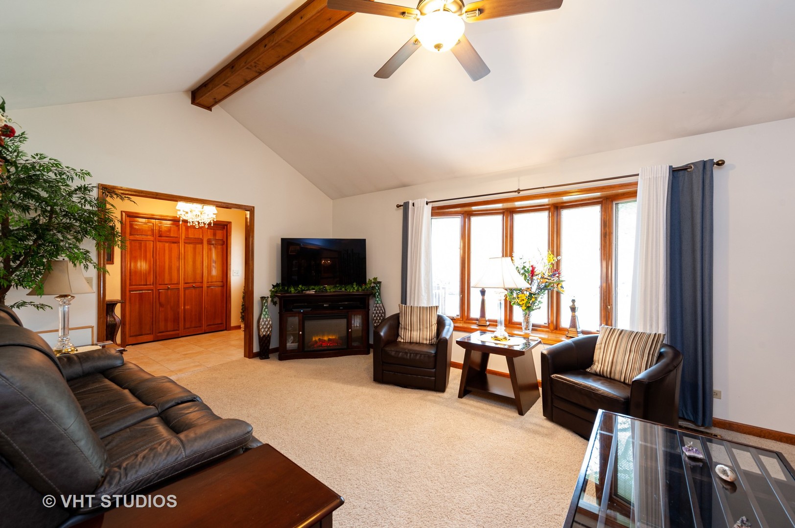 227 Perth Road Cary, IL 60013 - Photo 8 of 19 a living room with furniture and a flat screen tv