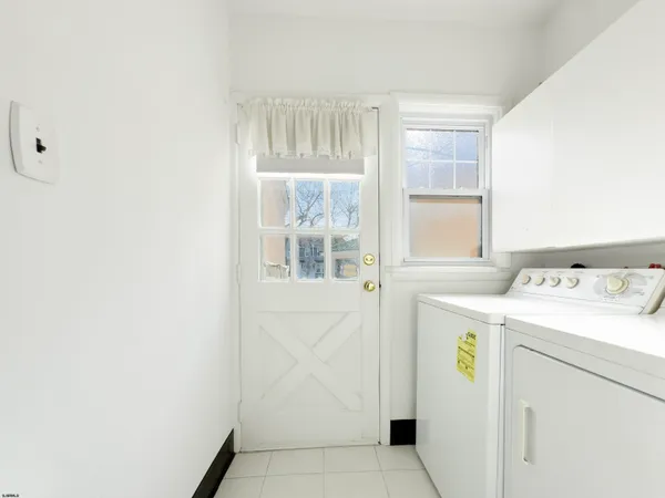 a view of storage and utility room with washer and dryer