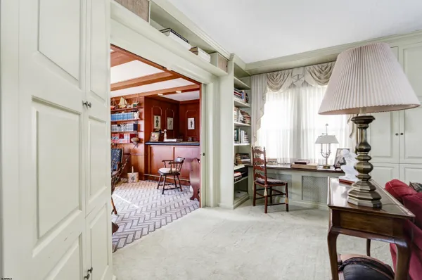 a view of a livingroom with furniture and a window