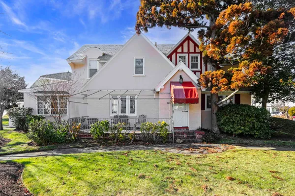 a front view of house with yard and seating space