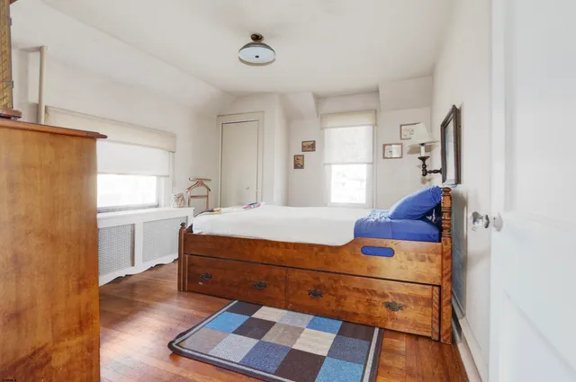 a room with a bed and a window