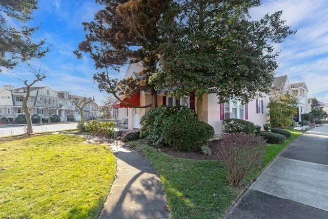 a swimming pool with outdoor seating and yard