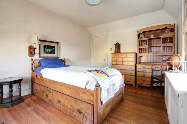 a bedroom with a bed and a closet