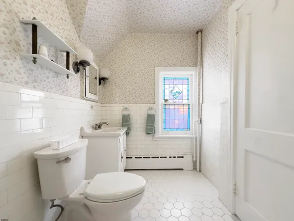 a bathroom with a toilet a sink and a bathtub