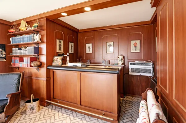 a living room with a bed and furniture