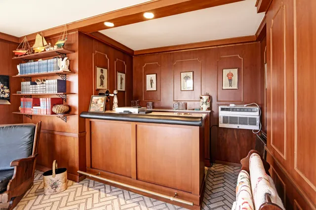 a living room with a bed and furniture