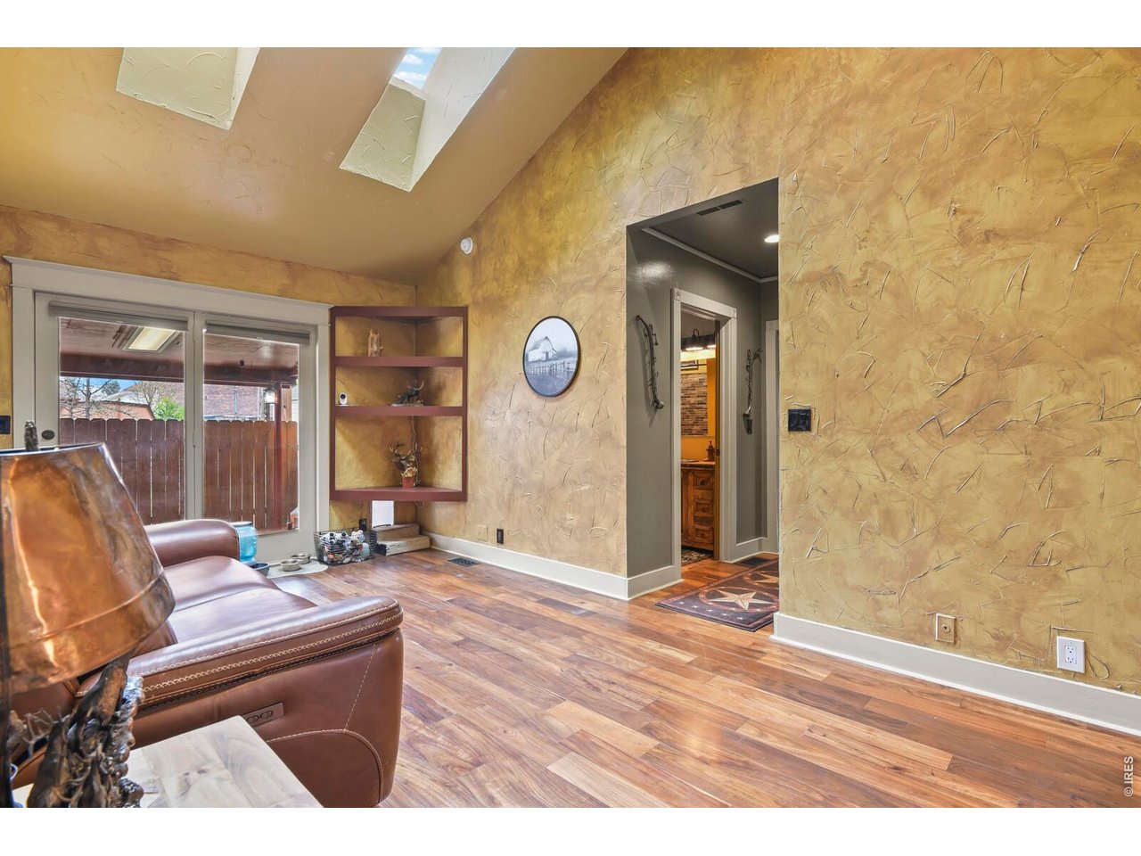 417 2nd Street Fort Lupton, CO 80621 - Photo 8 of 24 a living room with couch and a table