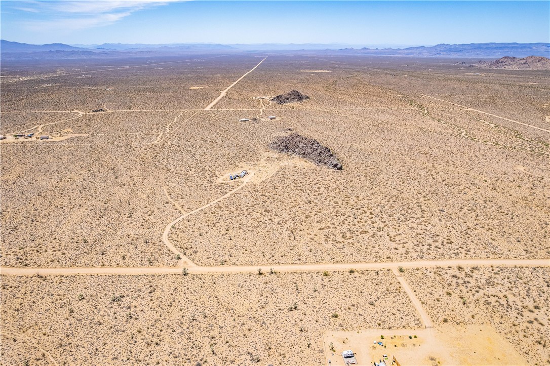 16435 South Wyatt Earp Road Yucca, AZ 86438 - Photo 47 of 57 Expansive desert landscape featuring natural rock formations and numerous unpaved access roads