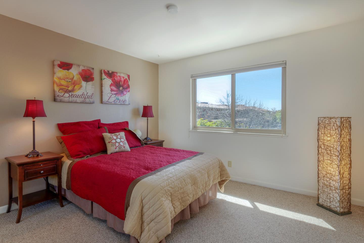 1375 Ruby Court, Unit 4 Capitola, CA 95010 - Photo 12 of 15 a bedroom with a bed and a window